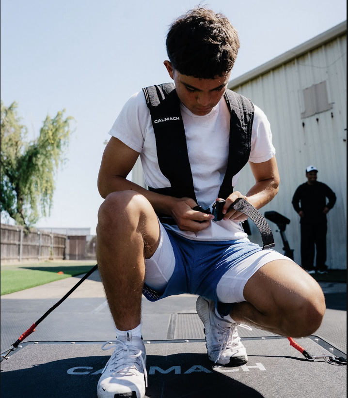 Athlete gearing up on Calmach board