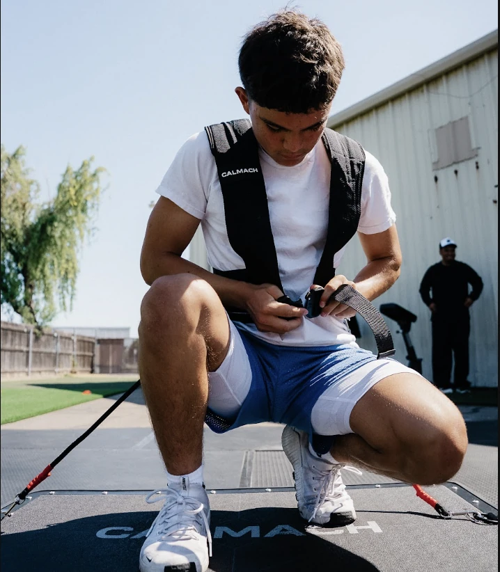 Athlete gearing up on Calmach board