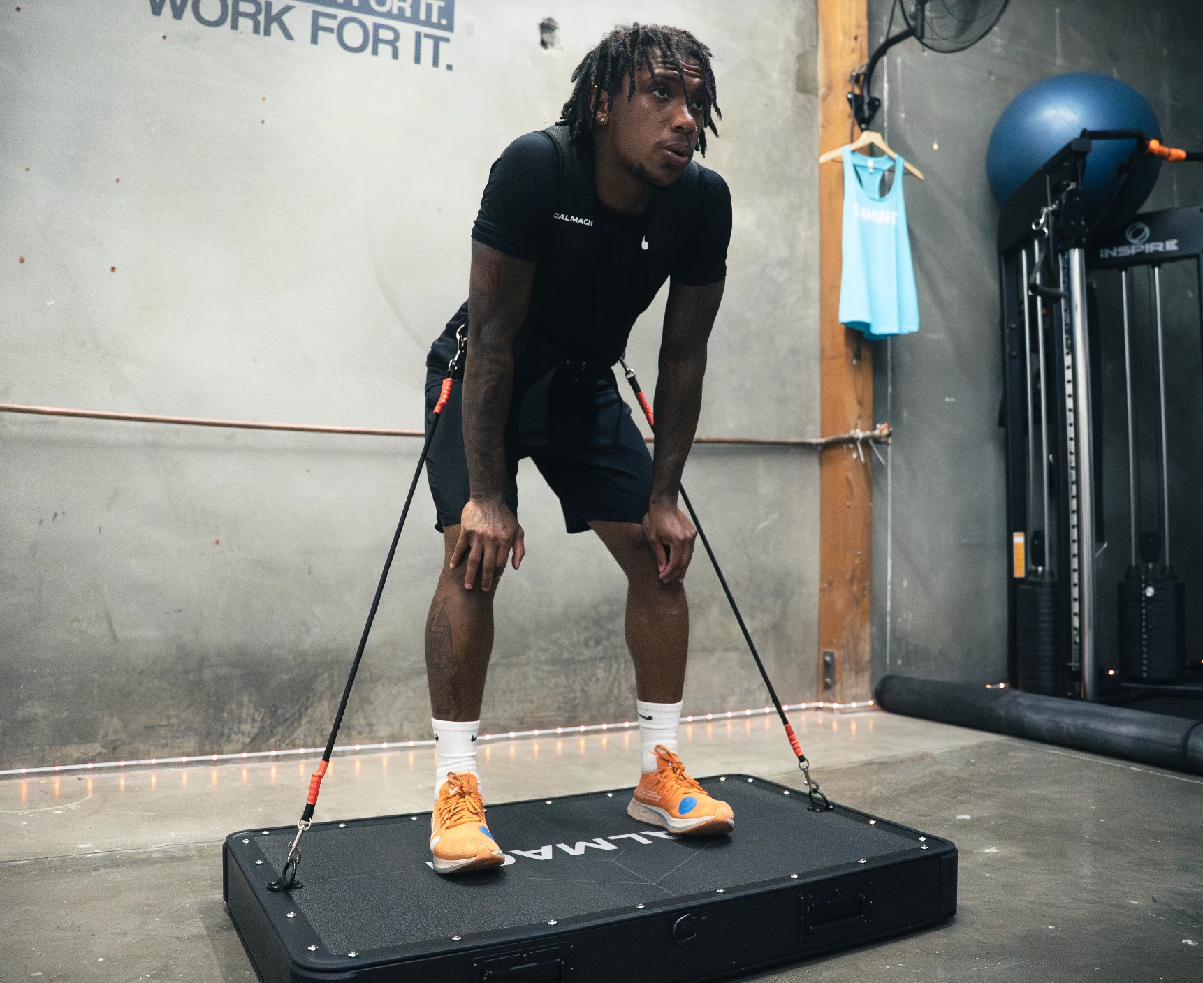 Athlete standing on Calmach board