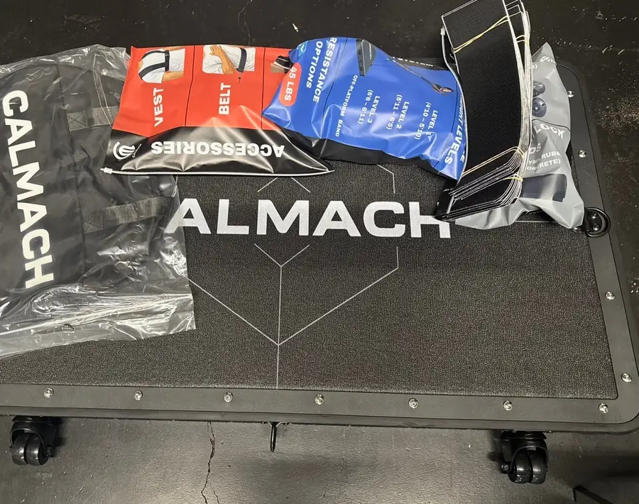 Calmach platform with the vest, belt and resistance band accessories laid out
